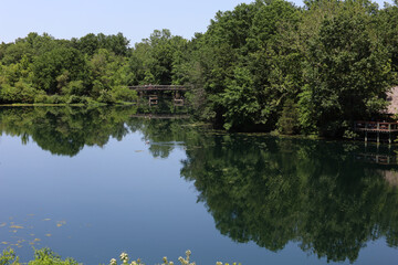 Beautiful view of a lake surrounded by trees in Swope Park, Kansas City, MO