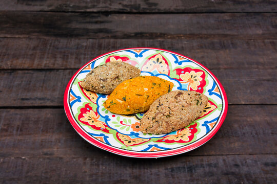 Individual portion vegan kibes with wooden background