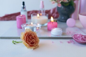 Fresh roses, candles, skin care ingredients, healthy lifestyle, relaxation, home cosmetics 