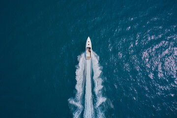 Speedboat wave speed water. Speed boat faster movement on the water top view. Speedboat movement on...