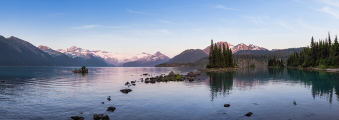 Panoramic View of Canadian Nature Landscape with glaciers and rocky mountains in the background. Garibaldi Lake, Near Whistler and Squamish, North of Vancouver, British Columbia, Canada. Sunny Sunset