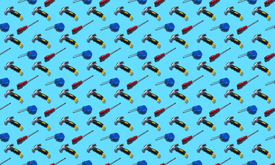 Hammers, screwdrivers and measuring tape on a blue background, pattern, hard shadows. Construction tools, repairs. Background for the design.