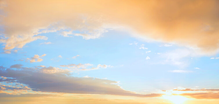 shiny yellow sunrise clouds and light blue sky © SusaZoom