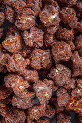 Gourmet sweet popcorn in close-up photo. Chocolate flavor. Top view
