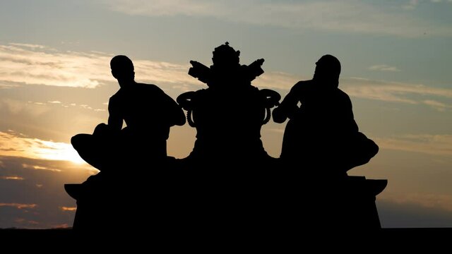 Sculpture of Michelangelo and Raphael over the Vatican museums Time Lapse at Sunrise with Colorful Clouds