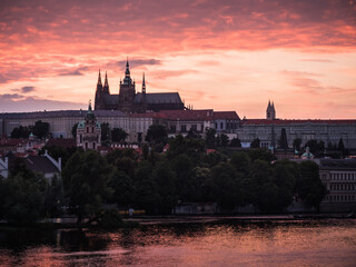 Fototapeta premium Saint Vitus Cathedral or Katedrala Svateho Vita on River Vltava in Prague, Czech Republic at Pink Sunset