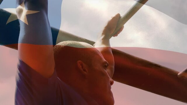 Animation of flag go chile over strong muscular man doing pull ups
