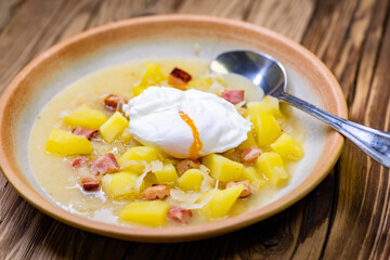 Czech traditional cabbage soup with smoked meat and potatoes