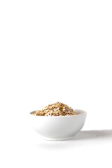 a bowl of oat flakes isolated on white background