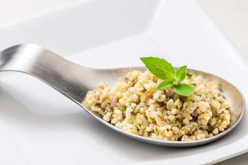 still life of bulgur salad with mint