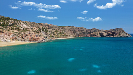 Aerial drone photo of scenic colourful volcanic rocky bay and emerald sandy beach of Paleochori a natural vacation paradise with resorts and water sport facilities in island of Milos, Cyclades, Greece