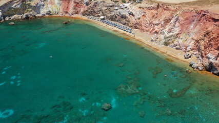Fototapeta na wymiar Aerial drone photo of scenic colourful volcanic rocky bay and emerald sandy beach of Paleochori a natural vacation paradise with resorts and water sport facilities in island of Milos, Cyclades, Greece