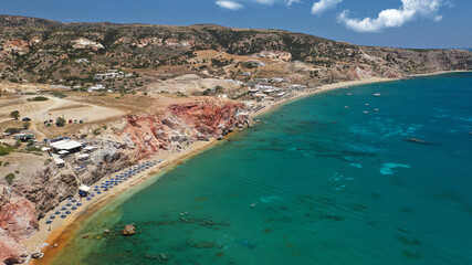 Aerial drone photo of scenic colourful volcanic rocky bay and emerald sandy beach of Paleochori a natural vacation paradise with resorts and water sport facilities in island of Milos, Cyclades, Greece