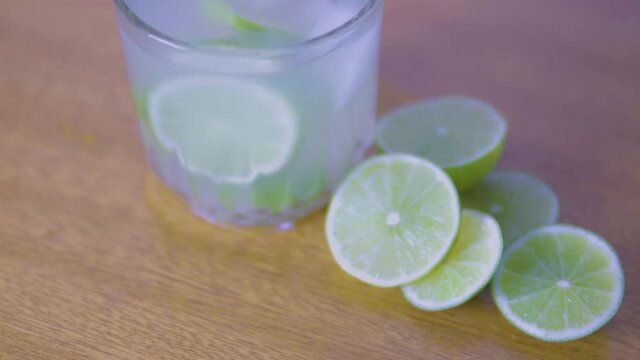 preparing a lemon drink in a bar. Lemonade for the summer.