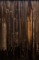 Background of an old natural wooden gradient darken interesting fence of beech texture inside vintage, retro proper vertical warm rural interior