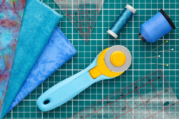 Home craft concept photo - patchwork  or quilt  tools and textile set flatlay.