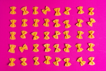 Farfalle Pasta on a pink background