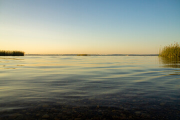 Calm beautiful view of the lake from and sky at sunrise