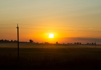 Calm beautiful sunrise over a rural field