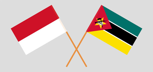 Crossed flags of Indonesia and Mozambique. Official colors. Correct proportion