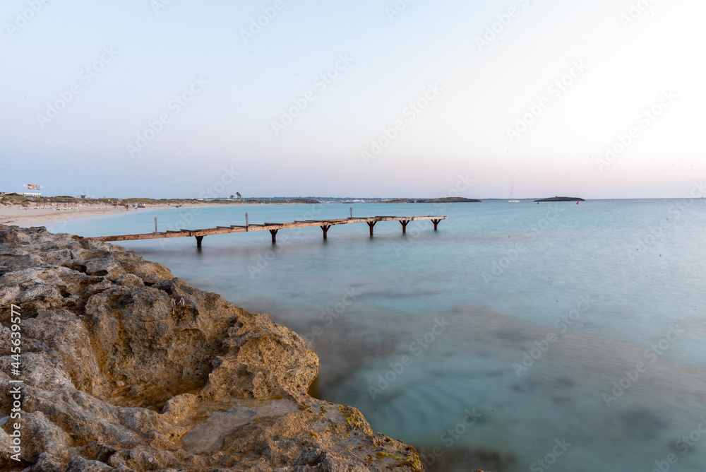 Canvas Prints Wooden pier on the deserted beach of Ses Illetes on the Formentera island, Spain