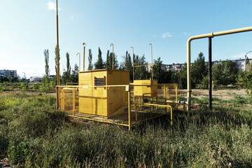 yellow gas station with warning signs side view