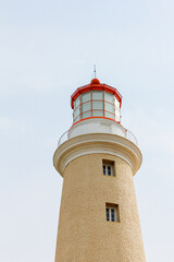 Red and yellow lighthouse on the coast of Atlantic Ocean in Punta del Este Uruguay