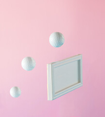 Abstact concept with white balls and wooden tile on pink background. Minimal lay out arrangement.