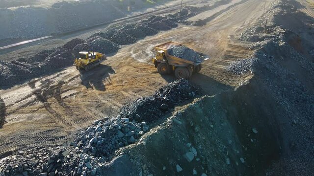 quarry truck transport of stone ore loading transportation overflying drone quarry