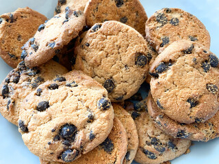 Background of oatmeal cookies with chocolate pieces. Oatmeal cookies close-up