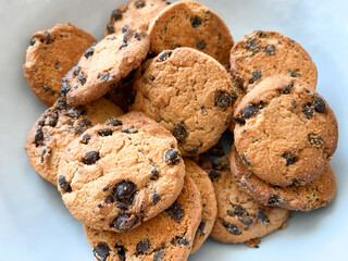 Background of oatmeal cookies with chocolate pieces. Oatmeal cookies close-up