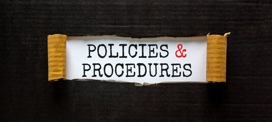 Policies and procedures symbol. Words 'Policies and procedures' appearing behind torn black paper. Beautiful black background. Business, policies and procedures concept, copy space. - obrazy, fototapety, plakaty