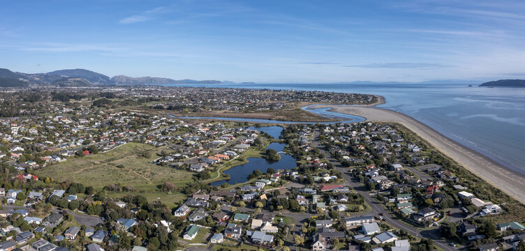 Aerial shot of Waikanae beach with the river mouth and ponds with Paraparaumu in the distance