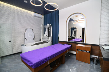 The interior of a massage room with a spa capsule in a luxurious modern wellness and SPA center...