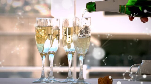 Animation of networks moving over champagne bottle being poured into four glasses