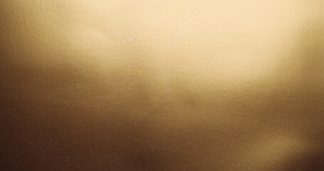 Closeup shot of a smooth gold surface for wallpapers - obrazy, fototapety, plakaty