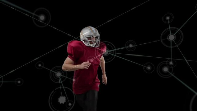Animation of network of connections over american football player on black background