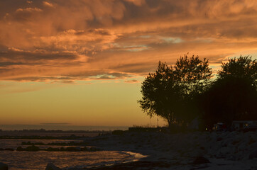 Gorgeous shot of an orange sunset at the beat of Fehmarn in Germany