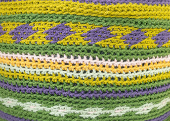 crochet project in progress, green yellow, violet, pink 