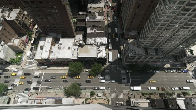 An extreme wide top down shot of a busy Manhattan street during the day.  	