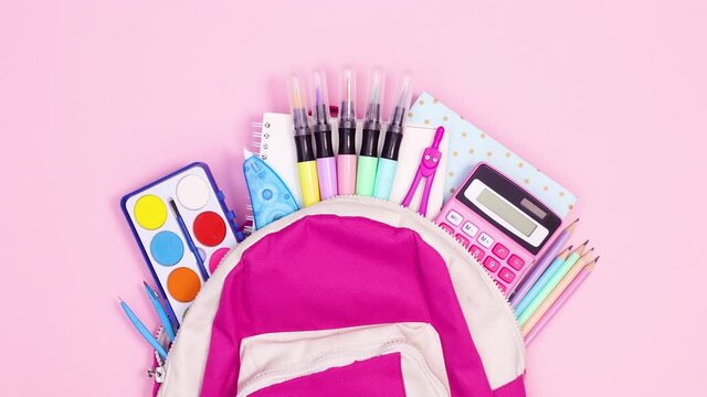 Pink school backpack appear on pink theme and school tools come out. Stop motion