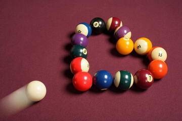 breaking heart concept using billiard balls