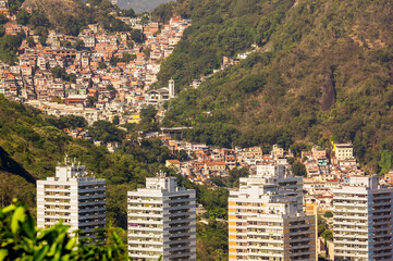 Fototapeta premium aerial view of the buildings in the neighborhood of botafogo in close up. slums on the hills