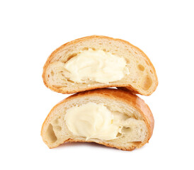 Halves of delicious croissant with cream on white background