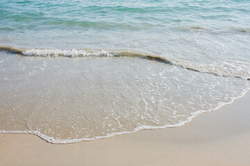 Close-up details of small ocean waves That blows ashore at the beach