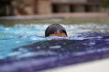 Boy Drowning In Swimming Pool