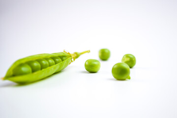 Falling green peas isolated on white background with clipping path