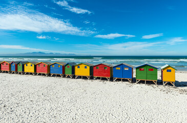 Muizenberg beach with colorful wooden beach cabins huts, Cape Town, South Africa. - obrazy, fototapety, plakaty