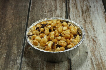Classic coffee cake topping with macadamia nut dressing with caramel. Popular sweet dessert menu in bakery shop. 