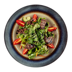 Isolated salad with warm veal and greens on the white background